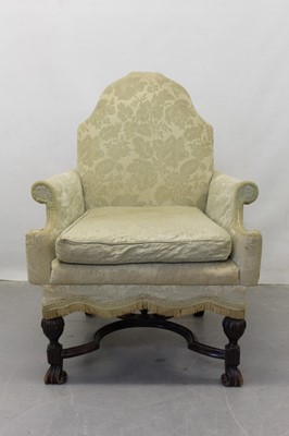 Lot 1251 - 19th century wing arm chair with arched shaped back, on shaped stretcher and carved legs