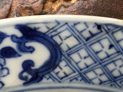 Lot 1 - Good pair of Chinese blue and white porcelain dishes, each painted with two figures in a rocky landscape