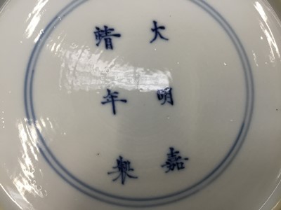 Lot 1 - Good pair of Chinese blue and white porcelain dishes, each painted with two figures in a rocky landscape
