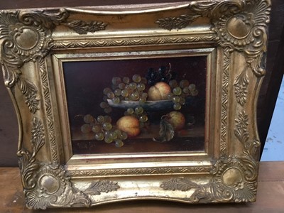 Lot 33 - Pair of Continental school oils on panel - still life of fruit, indistinctly signed, in gilt frames