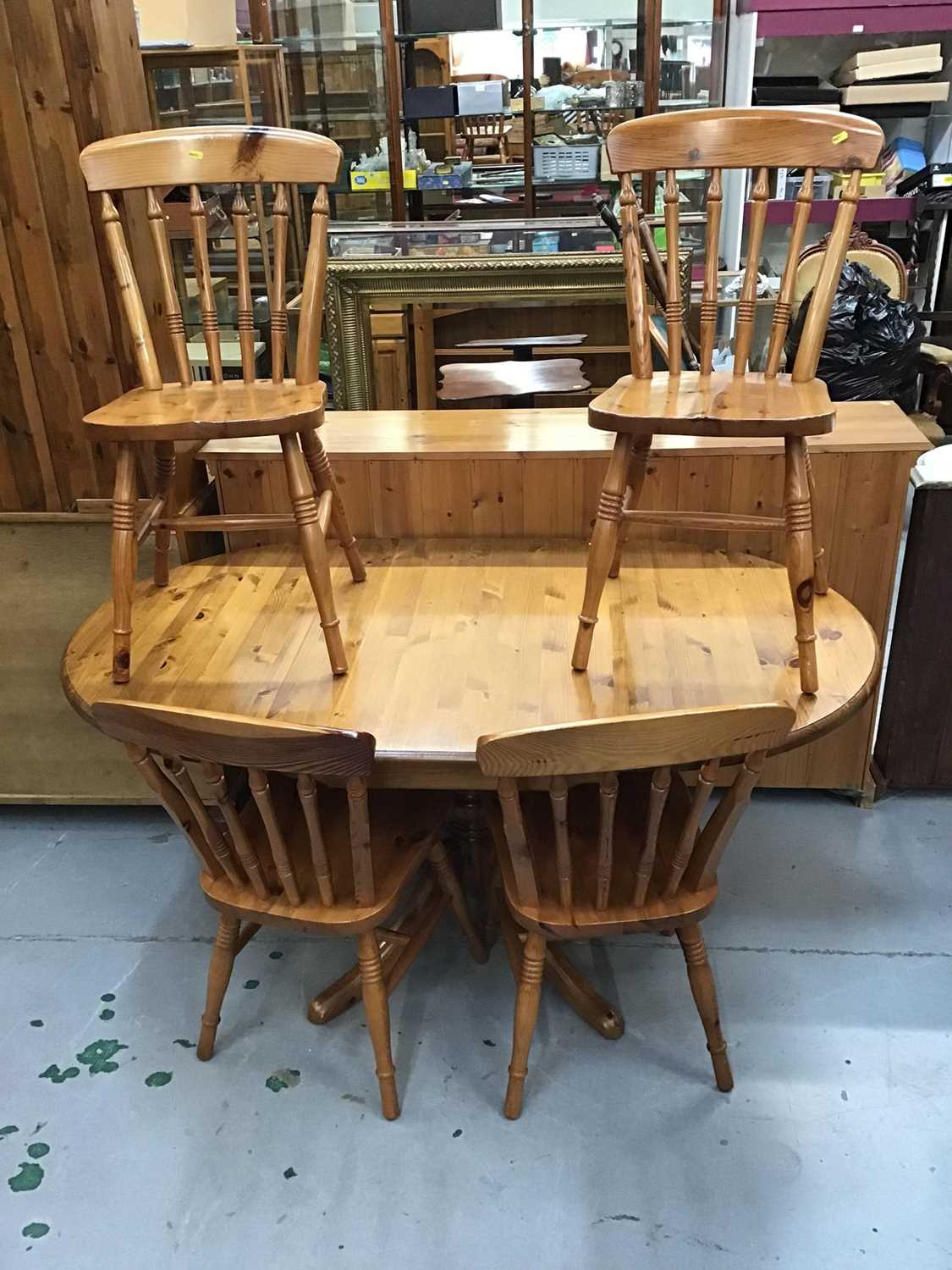 Lot 935 - Pine oval breakfast table and four pine kitchen chairs