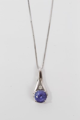 Lot 460 - Tanzanite and diamond pendant in 14ct white gold mount on chain