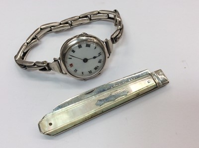 Lot 659 - Silver cased wristwatch on expandable sterling silver bracelet, together with a silver and mother of pearl fruit knife