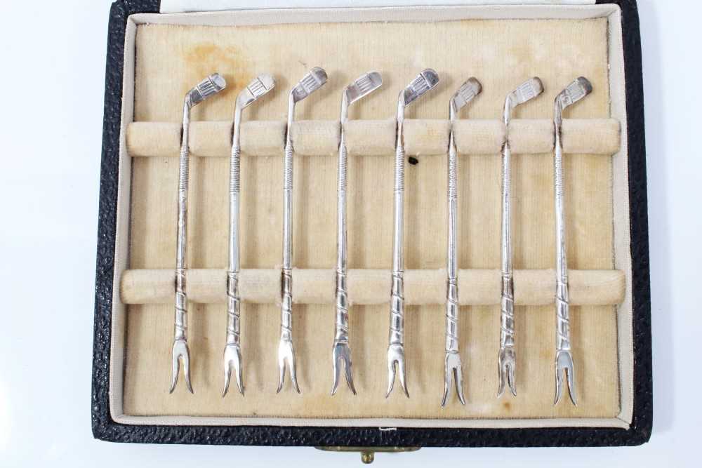 Lot 7 - Set of eight silver golf club lobster picks, in fitted case