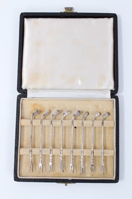 Lot 7 - Set of eight silver golf club lobster picks, in fitted case