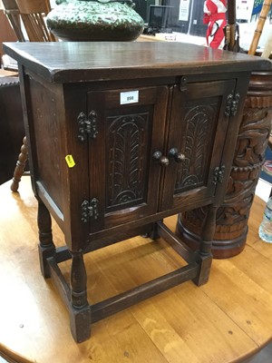 Lot 898 - Old charm style side cupboard with carved decoration and turned legs joined by stretchers