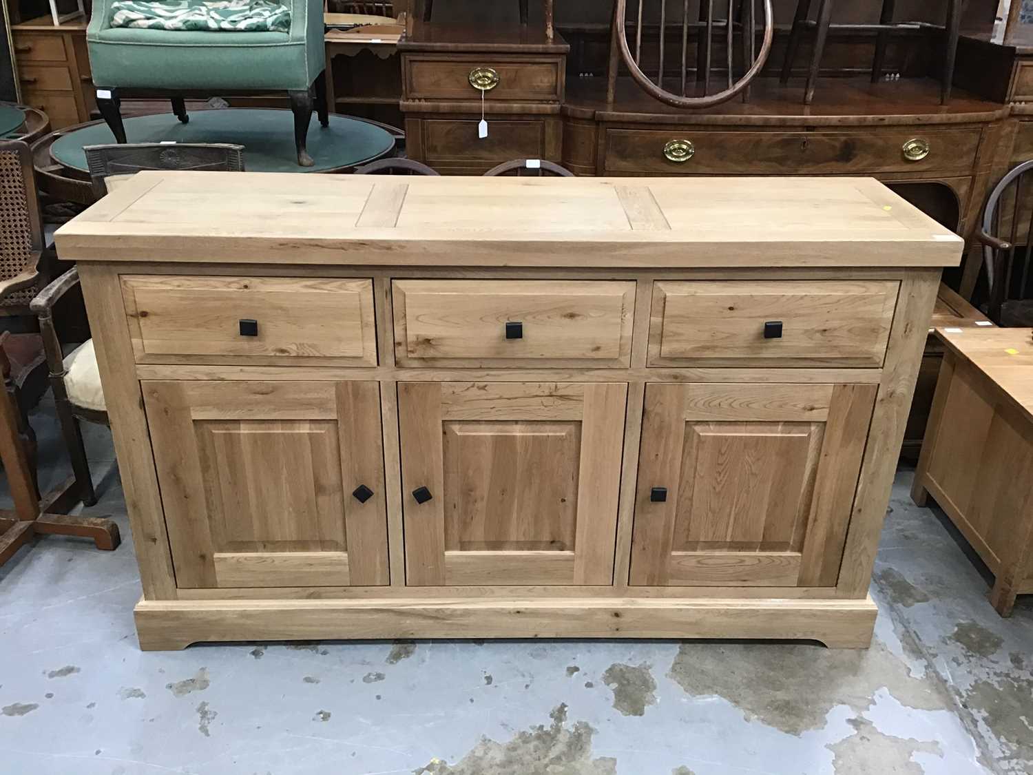 Lot 873 Light oak sideboard with three drawers and