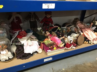 Lot 222 - Collection of dolls, including bisque, plaster and others, dolls' clothing and a collectors' book