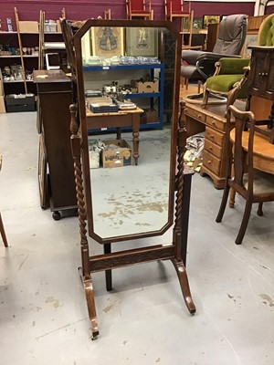 Lot 947 - 1920s oak and walnut cheval mirror with spiral twist supports