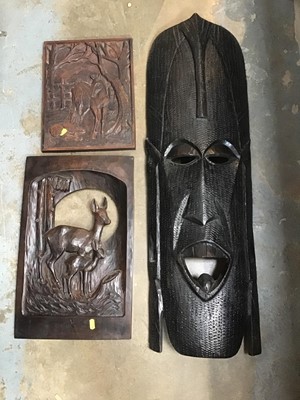 Lot 228 - Large African carved wooden mask, and two carved wooden panels