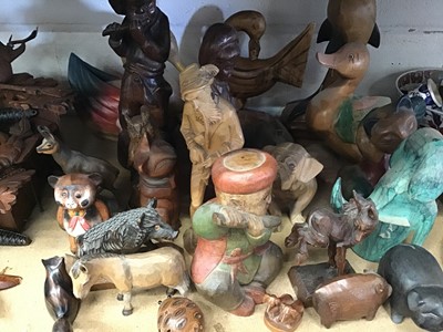 Lot 219 - Collection of carved wooden figures and ornaments, and a Black Forest clock