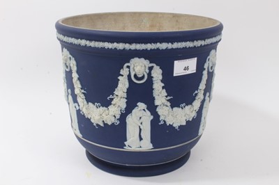 Lot 46 - Large antique Wedgwood dark blue jasper ware jardinière, circa 1890, decorated with classical figures and swags, marks to base, 23cm height x 26cm diameter