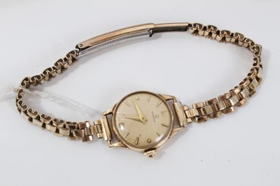 Lot 564 - 1950s ladies Omega 9ct gold cased wristwatch on rolled gold bracelet with original receipt of purchase and original box