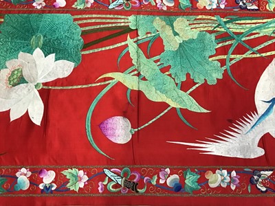 Lot 1776 - Large Chinese embroidered red silk wall hanging. Polychrome silk thread and metallic embroidered white crane, insects, symbols, bats and flowers . Pink cotton backing and wood baton for handing. 29...