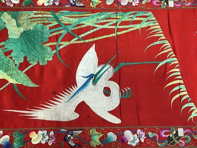 Lot 1776 - Large Chinese embroidered red silk wall hanging. Polychrome silk thread and metallic embroidered white crane, insects, symbols, bats and flowers . Pink cotton backing and wood baton for handing. 29...