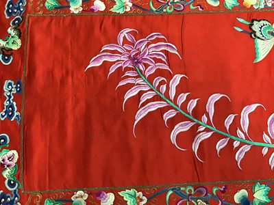 Lot 1777 - Large Chinese embroidered red silk wall hanging. Polychrome silk thread embroidered colourful cockerel, lotus flowers, other flowers, insects, clouds and symbols. Pink cotton backing and wood rod f...