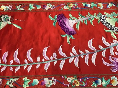 Lot 1777 - Large Chinese embroidered red silk wall hanging. Polychrome silk thread embroidered colourful cockerel, lotus flowers, other flowers, insects, clouds and symbols. Pink cotton backing and wood rod f...