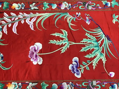 Lot 1777 - Large Chinese embroidered red silk wall hanging. Polychrome silk thread embroidered colourful cockerel, lotus flowers, other flowers, insects, clouds and symbols. Pink cotton backing and wood rod f...