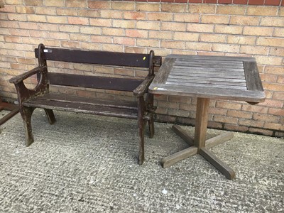 Lot 959 - Teak garden table and an old garden bench