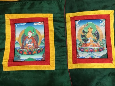 Lot 1780 - Chinese embroidered silk Dragon wall hanging plus three silk brocade dragon hangings.  Also two Tibetan Thanka   painted silk panels.