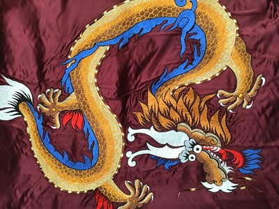 Lot 1780 - Chinese embroidered silk Dragon wall hanging plus three silk brocade dragon hangings.  Also two Tibetan Thanka   painted silk panels.