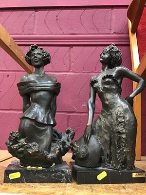 Lot 584 - Two bronzed resin sculptures of Ladies on stone plinths