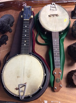 Lot 441 - Two banjos with cases