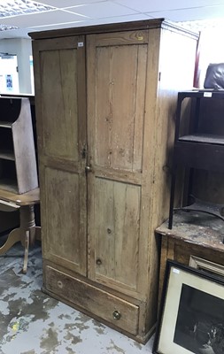 Lot 1053 - Early 19th century pine cupboard enclosed by two panelled doors with drawer below