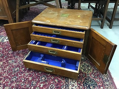 Lot 1034 - Edwardian oak cutlery cabinet with four drawers enclosed by two panelled doors