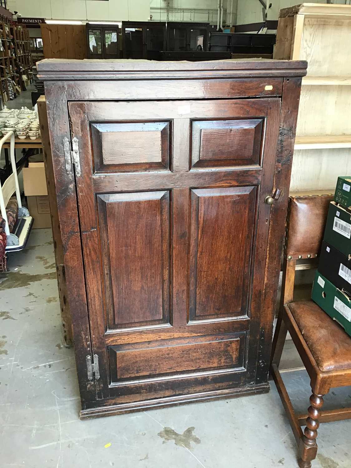 Lot 1048 - 18th century panelled oak cupboard enclosed by a single fielded panelled oak door (live woodworm to the top and back)