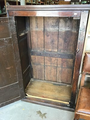 Lot 1048 - 18th century panelled oak cupboard enclosed by a single fielded panelled oak door (live woodworm to the top and back)