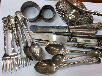 Lot 691 - Silver handled cutlery, other silver and white metal cutlery, two silver napkin rings and Continental silver candlestick