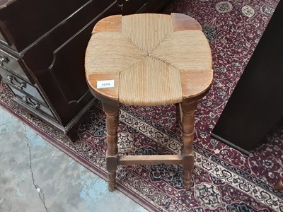 Lot 1059 - Set of four bar/kitchen stools with rush seats, another stool and a tiled top occasional table