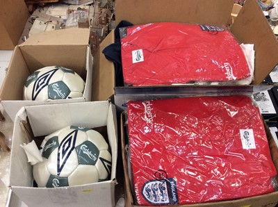 Lot 476 - Two boxes England football polo tops, other sports T-shirt’s and two Carlsberg footballs