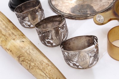 Lot 250 - Selection of miscellaneous early 20th century silver of varying condition, including an antler and silver table lighter, capstan inkwell, three napkin rings, two photograph frames and other items (...