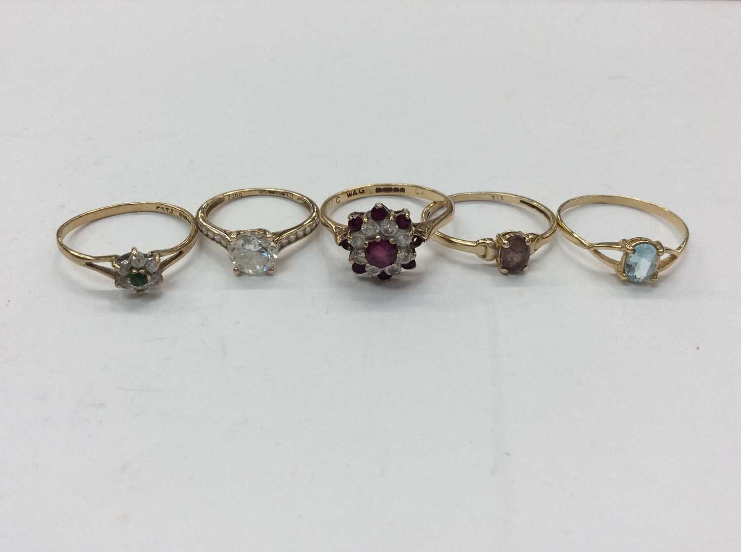 Lot 669 - Five 9ct gold gem set dress rings