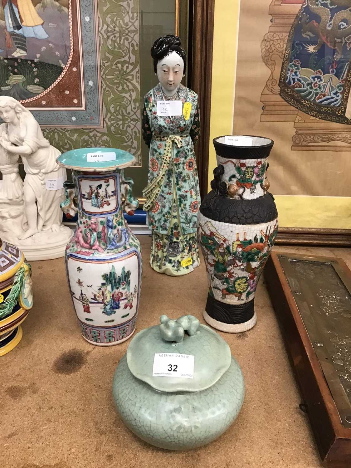 Lot 32 - Two 19th century vases, knodding figure and a celadon pot with cover