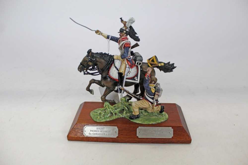 Lot 1405 - Impressive The Stadden Edition cast lead military figure group by Charles C. Stadden, Soldat Premier Regiment de Cuirassier c1815, Voltgeur 45e de Ligne c1815, on wooden plinth, approx 18cm in heig...