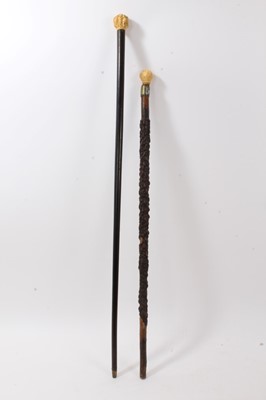 Lot 709 - 19th century ebonised cane with Japanese carved ivory knop, and another cane