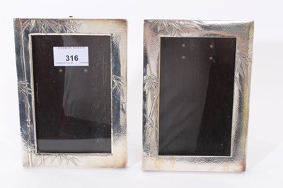 Lot 316 - Two late 19th/early 20th century Japanese silver photo frames