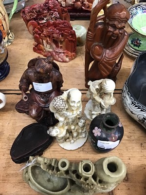 Lot 11 - Oriental soapstone and resin carved figures, together with two lacquered papier-mâché dishes and other oriental items