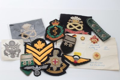 Lot 611 - Group of assorted cloth military badges to include American and British (1 box)