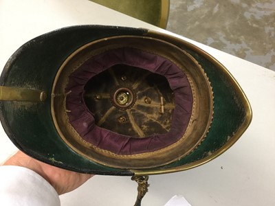 Lot 635 - Victorian Lincolnshire Regiment Officers' Blue Cloth helmet with bi metal regimental badge, brass spike and fittings, brass chin chains and leather head band, in japanned tin transit case
