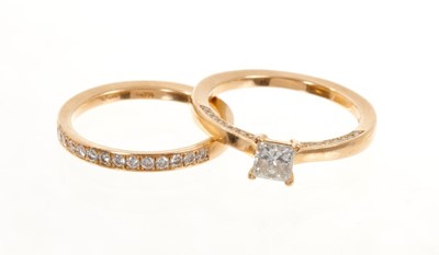 Lot 433 - Diamond princess cut single stone ring and eternity ring