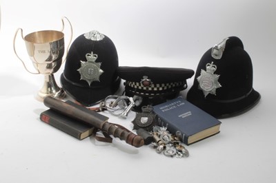 Lot 649 - Three Elizabeth II Essex Police hats, together with a pair of hand cuffs, truncheon, badges and other police related items