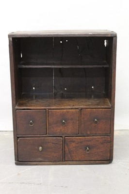 Lot 1266 - 18th century oak spice cupboard with open shelf above an arrangement of five drawers