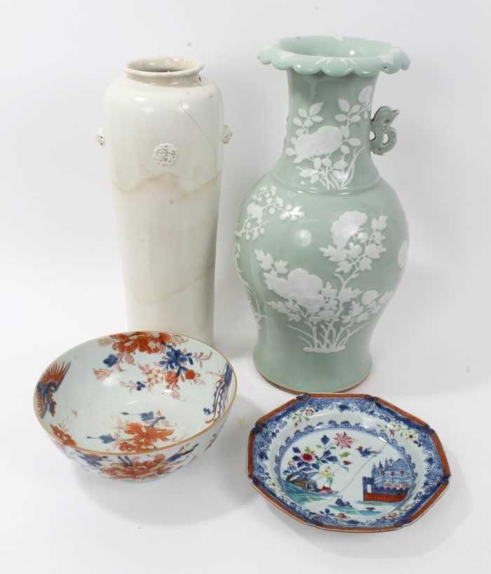 Lot 28 - Antique Chinese ceramics, including a large 17th/18th century Dehua blanc de chine cylindrical vase with moulded masks and roundels, 40.5cm height, a 19th century celadon ground vase, an 18th centu...