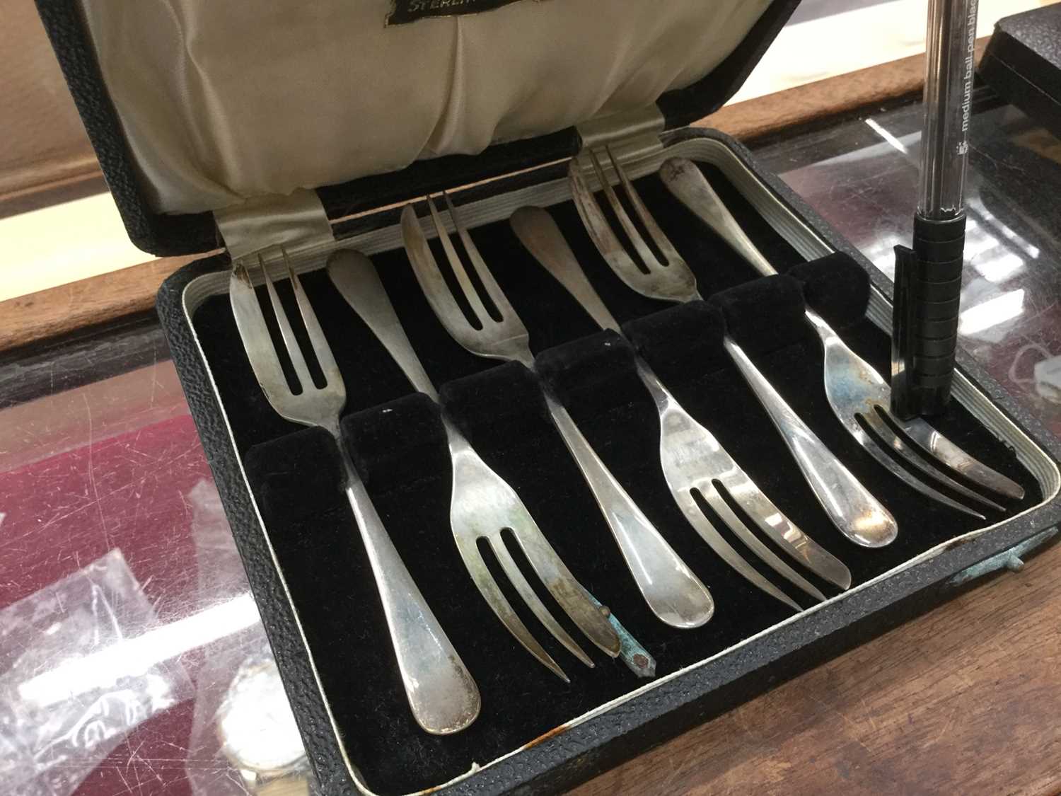 Lot 687 - Six silver cake forks by Viners in a fitted case