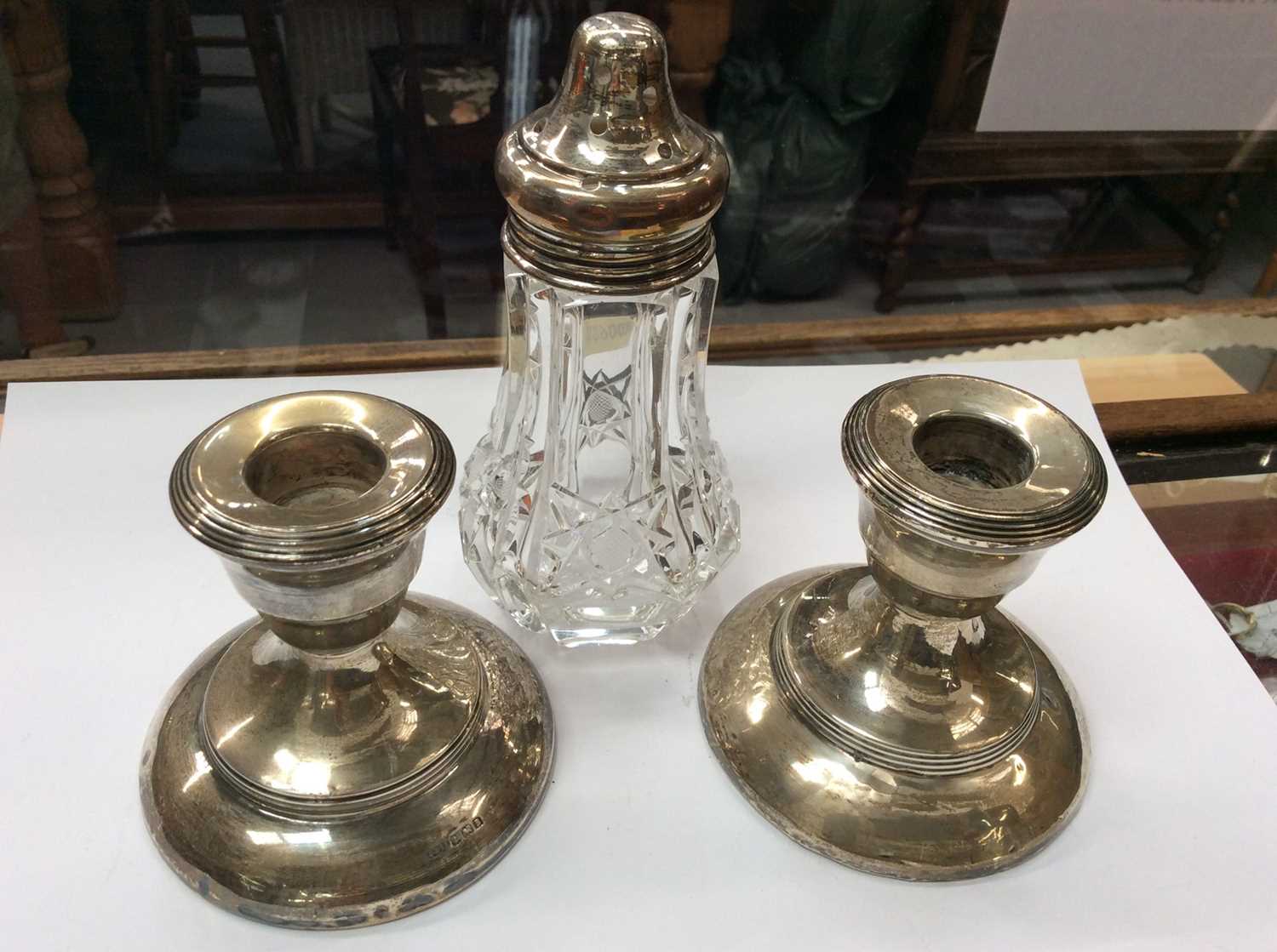 Lot 679 - Pair silver dwarf candlesticks and silver topped glass sugar castor