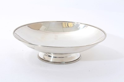 Lot 280 - 1940s silver dish of circular form with bead border, on a domed circular foot (Sheffield 1945) James Dixon & Son. All at approximately 12ozs. 20.5cm diameter.